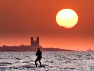 Minnis Bay and sunset over Reculver Towers with kiteurfer 3