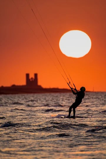 Minnis Bay sunset over Reculver Towers and kitesurfer 4